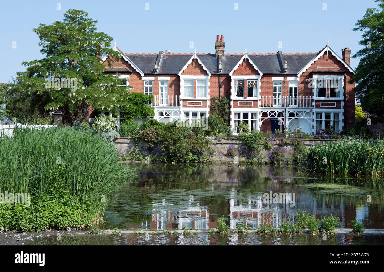 Kew Green Pond with houses behind, Kew, London Borough of Richmond