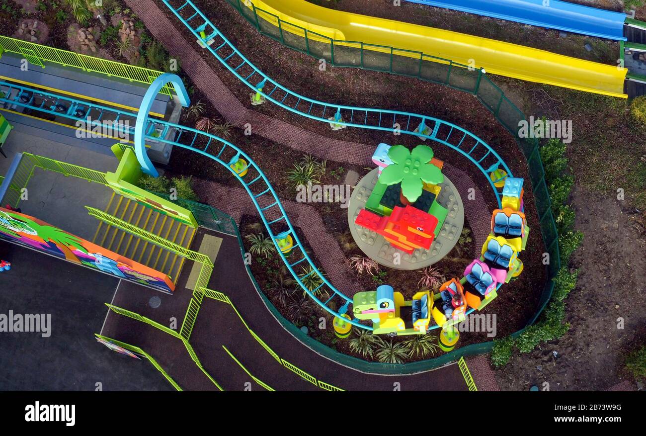 Creative lead Rosie Brailsford tests the world's first DUPLO Dino coaster at LEGOLAND Windsor Resort, Berkshire, as part of a makeover of the bigger and better DUPLO Valley land which opens to the public on Saturday 14 March. Stock Photo