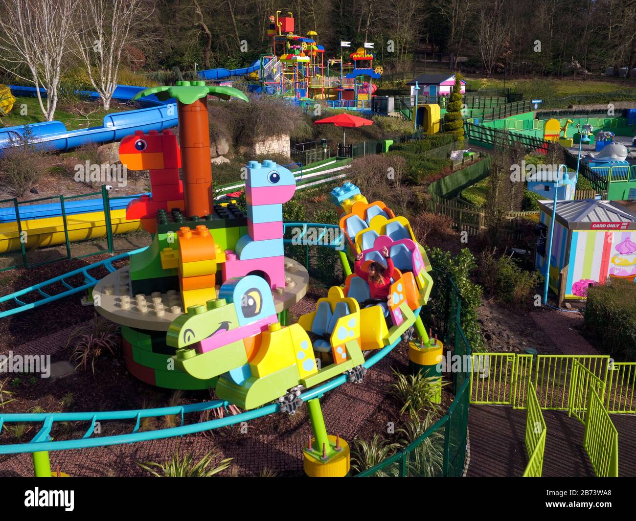 Creative lead Rosie Brailsford tests the world's first DUPLO Dino coaster at LEGOLAND Windsor Resort, Berkshire, as part of a makeover of the bigger and better DUPLO Valley land which opens to the public on Saturday 14 March. Stock Photo