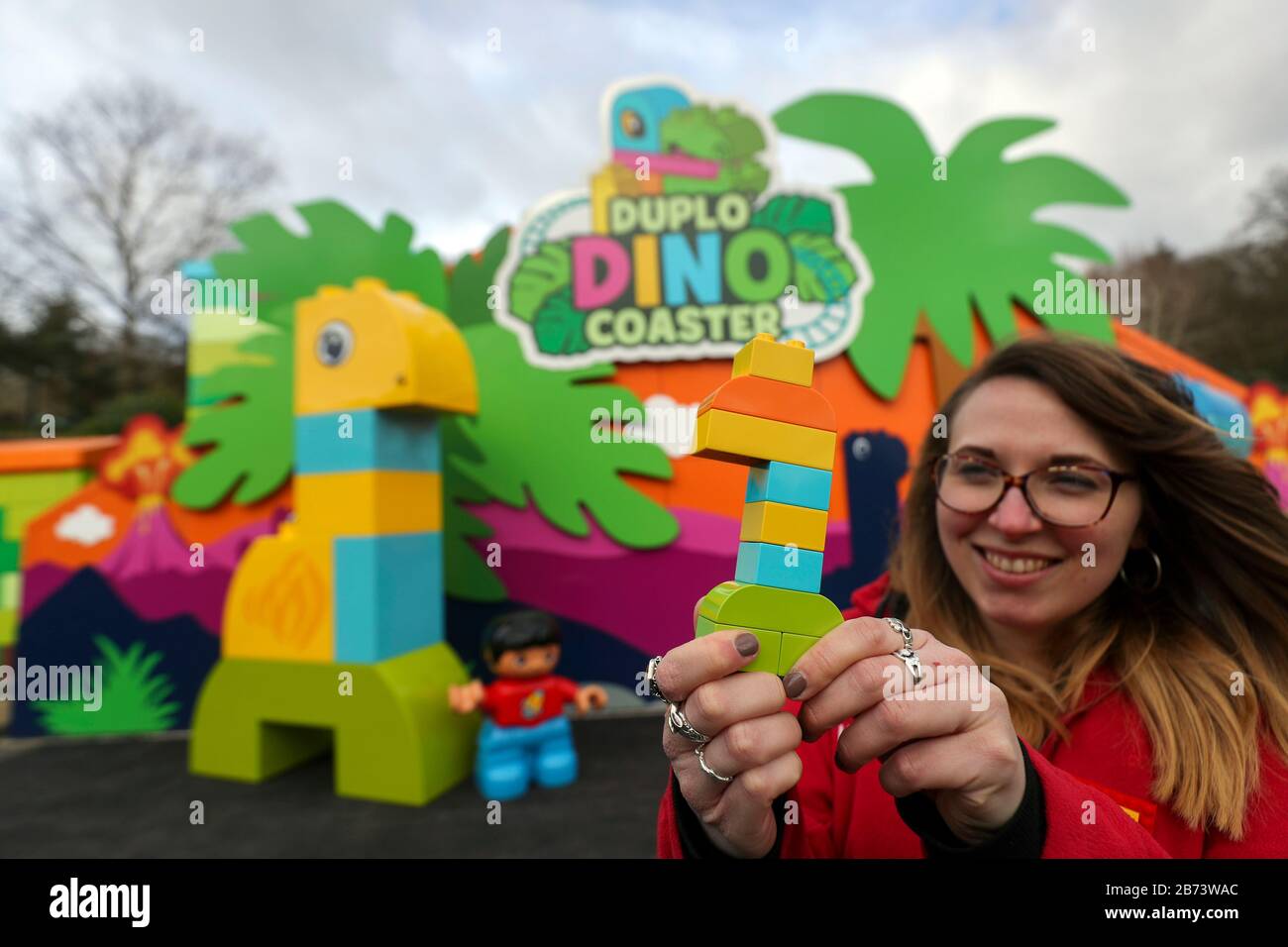 Creative lead Rosie Brailsford in front of the world's first DUPLO Dino coaster at LEGOLAND Windsor Resort, Berkshire, as part of a makeover of the bigger and better DUPLO Valley land which opens to the public on Saturday 14 March. Stock Photo