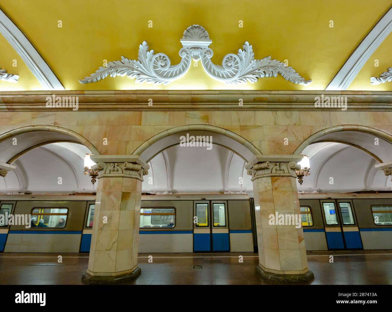 Ornate arches with underground train at Komsomolskaya Metro station platform, Moscow subway, Russian Federation Stock Photo
