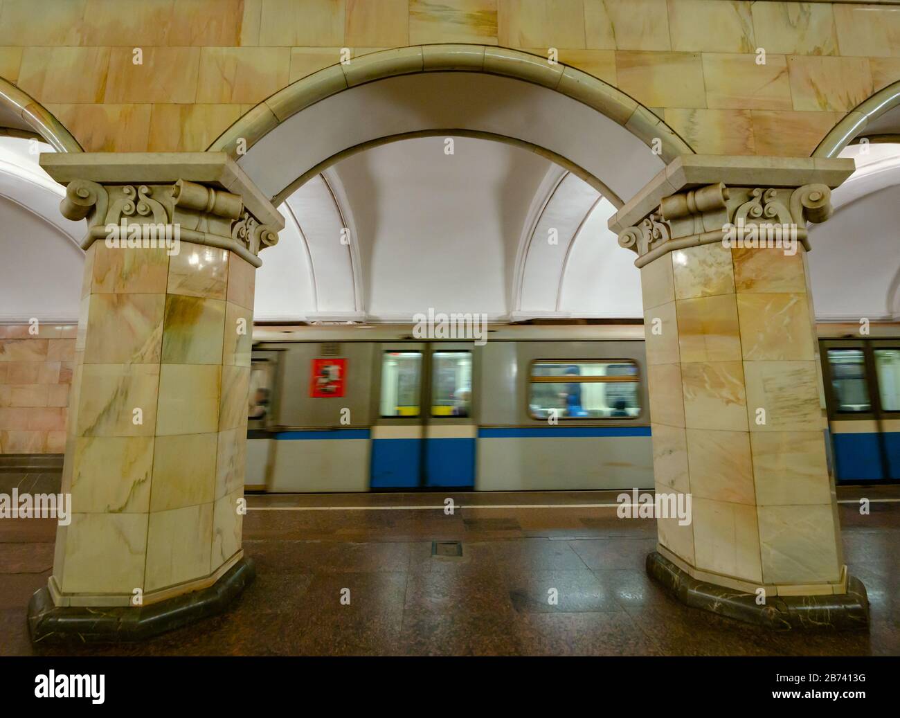 Ornate arch decoration with underground train at Komsomolskaya Metro station platform, Moscow subway, Russian Federation Stock Photo