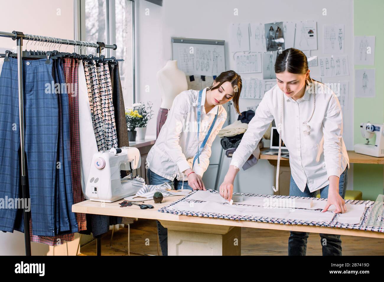 Two tailors work on sewing hi-res stock photography and images - Alamy