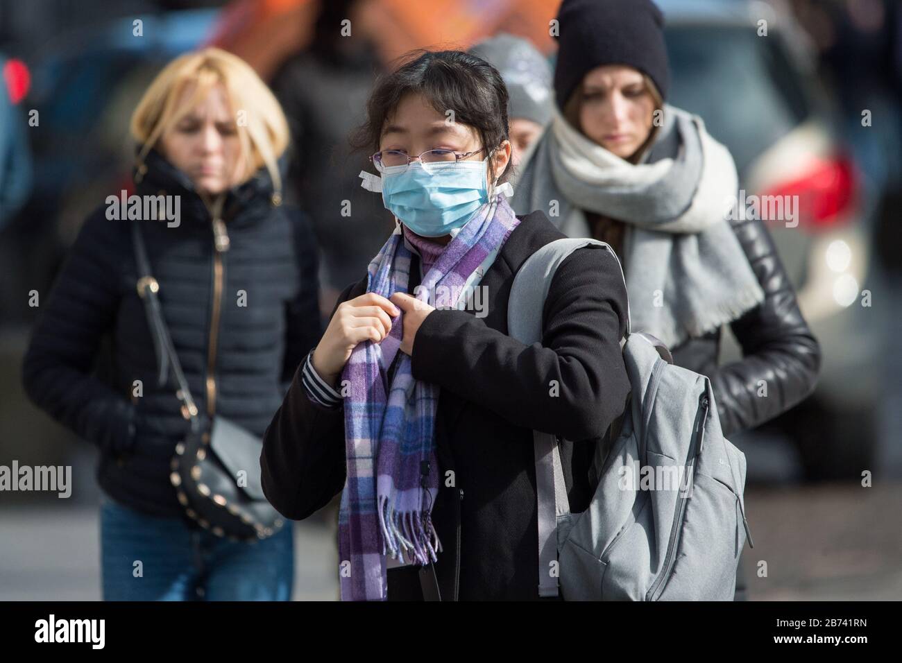 Edinburgh, UK. 13th Mar, 2020. Pictured: People seen wearing masks and covering their nose and mouth with scarves due to the Coronavirus pandemic. Credit: Colin Fisher/Alamy Live News Stock Photo