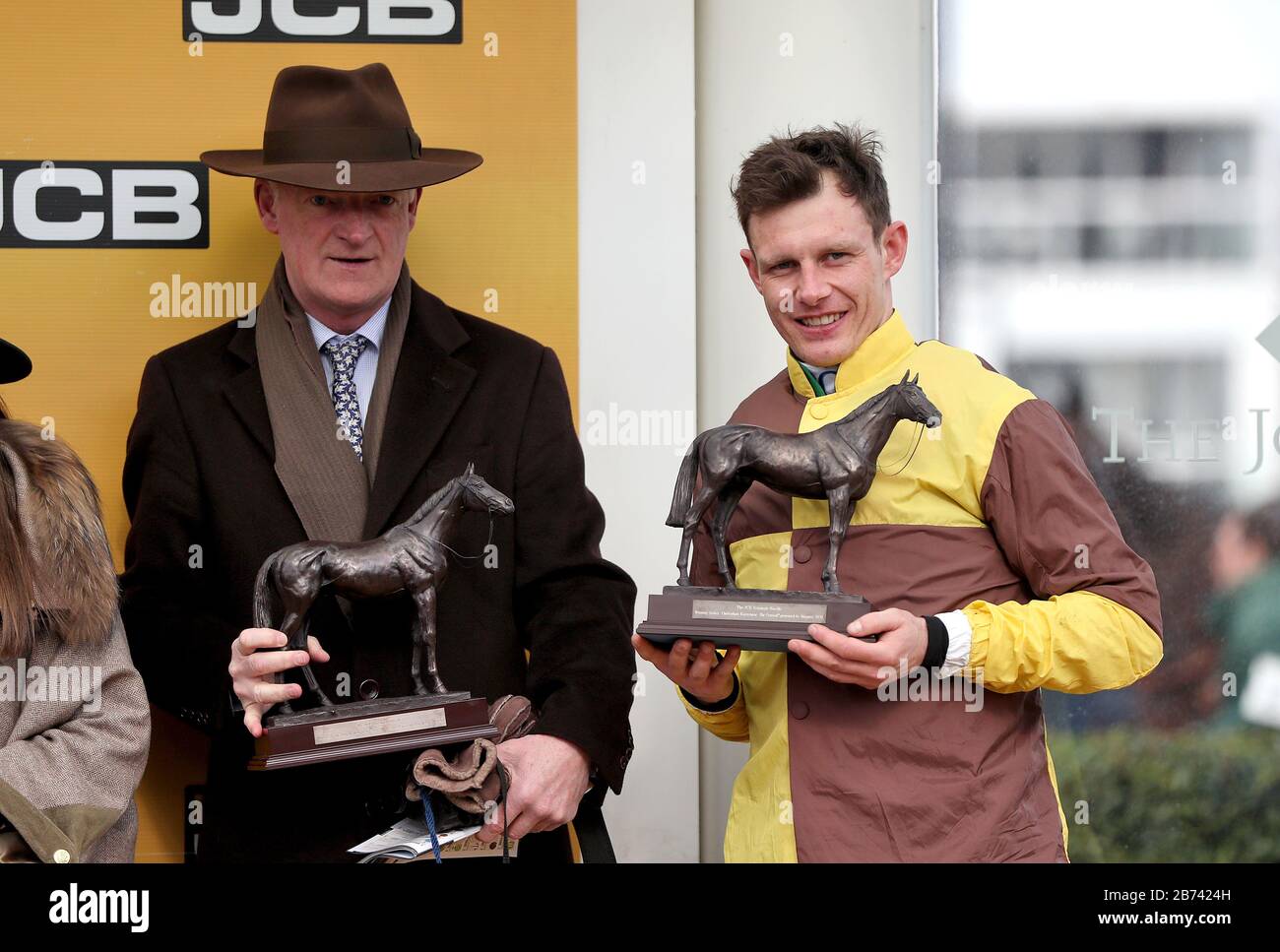 Trainer Willie Mullins (2nd right) and jockey Paul Townend (right) with the winning owners after Burning Victory won the JCB Triumph Hurdle during day four of the Cheltenham Festival at Cheltenham Racecourse. Stock Photo