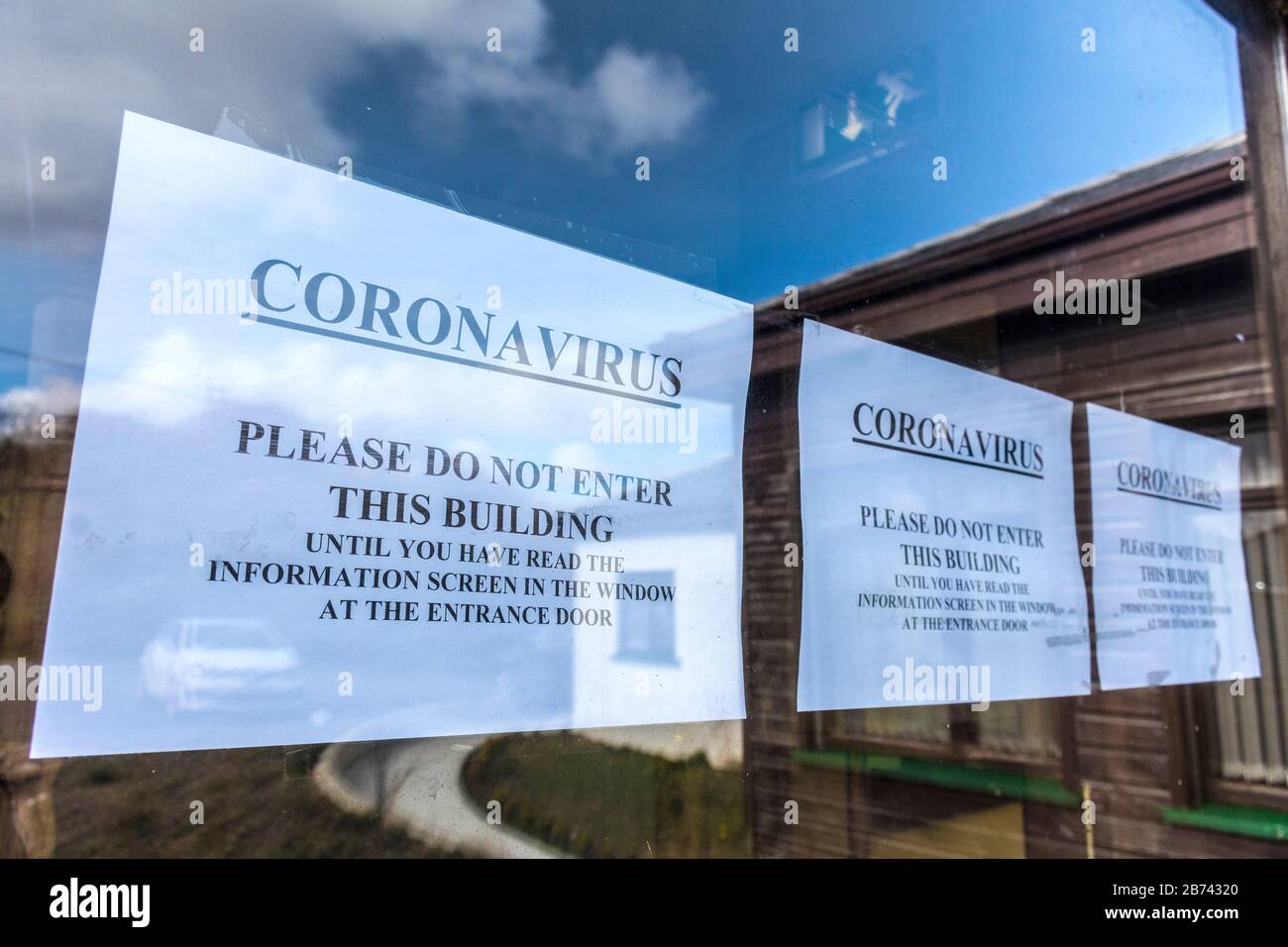 Ardara, County Donegal, Ireland. 13th March 2020. Advice not to enter Ardara Medical Centre before reading containment notice regarding Coronavirus, Covid-19, as infections increase throughout the Republic. Stock Photo