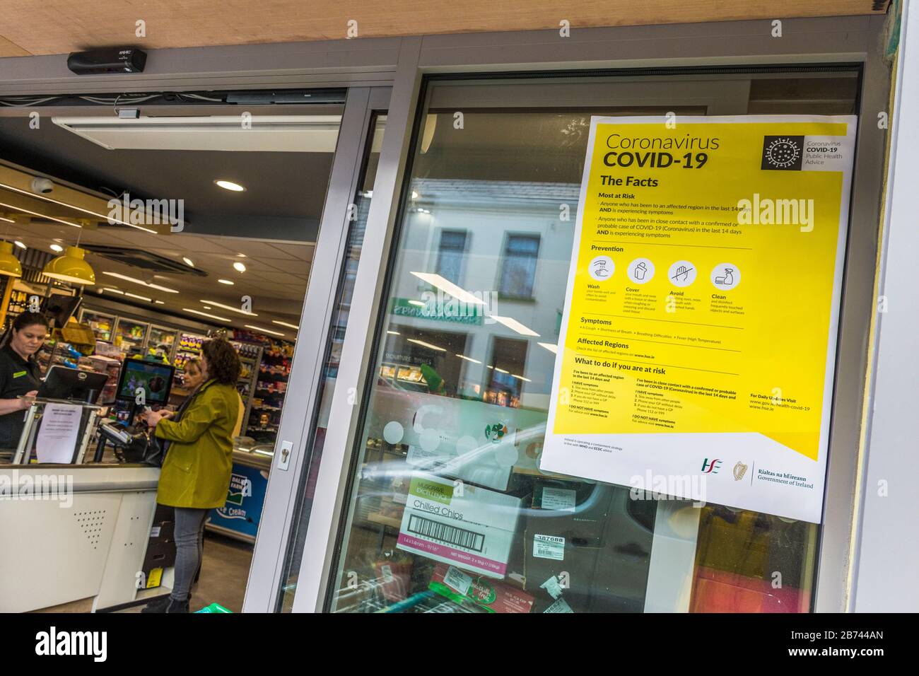 Ardara, County Donegal, Ireland. 13th March 2020. A Government Health Service (HSE) notice explains measures to contain Coronavirus, Covid-19, outside the mini-supermarket in the north-west coastal village. Stock Photo
