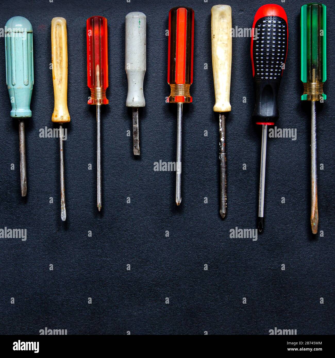 Screwdrivers of different shapes, sizes and colors for repair and ...