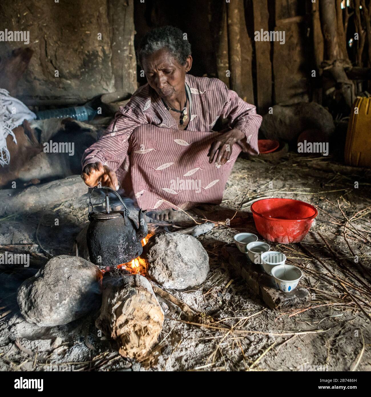 Villager brewing coffee over an open fire, Simien Mountains, Ethiopia Stock Photo