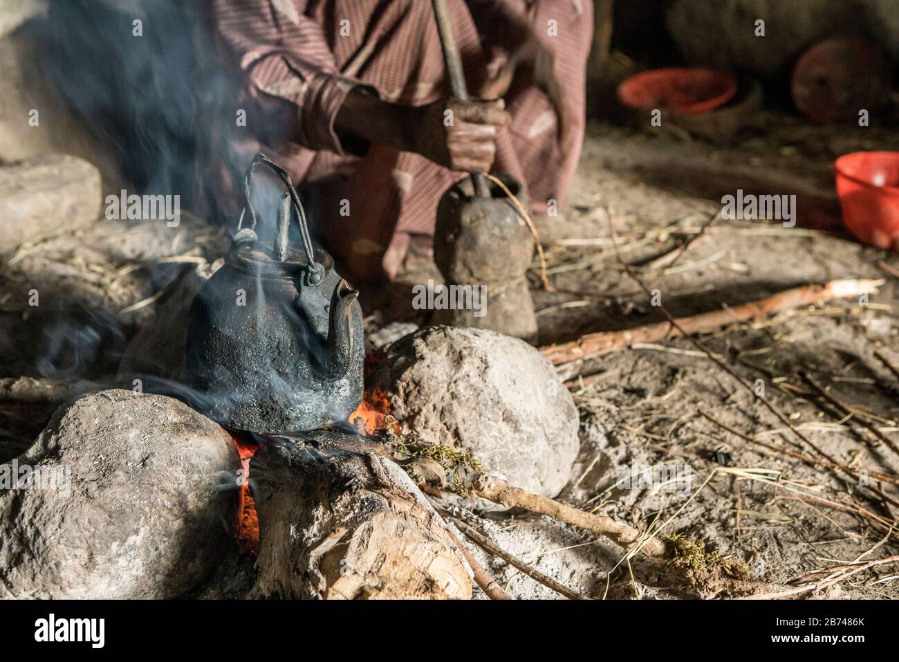 Brewing coffee over an open fire, Simien Mountains, Ethiopia Stock Photo