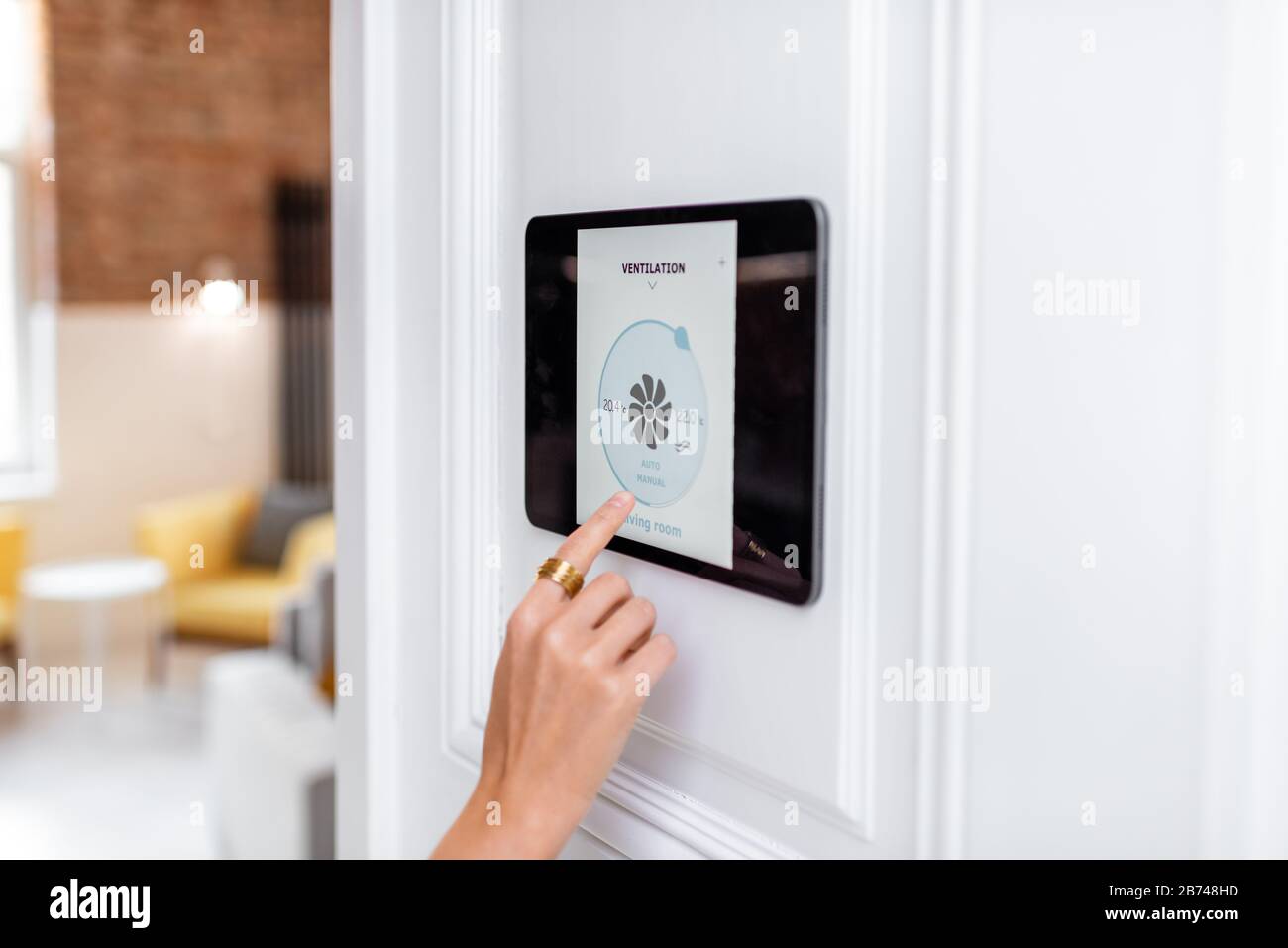 Controlling home ventilation or conditioning with a digital touch screen  panel. Concept of wireless ventilation control and smart home Stock Photo -  Alamy