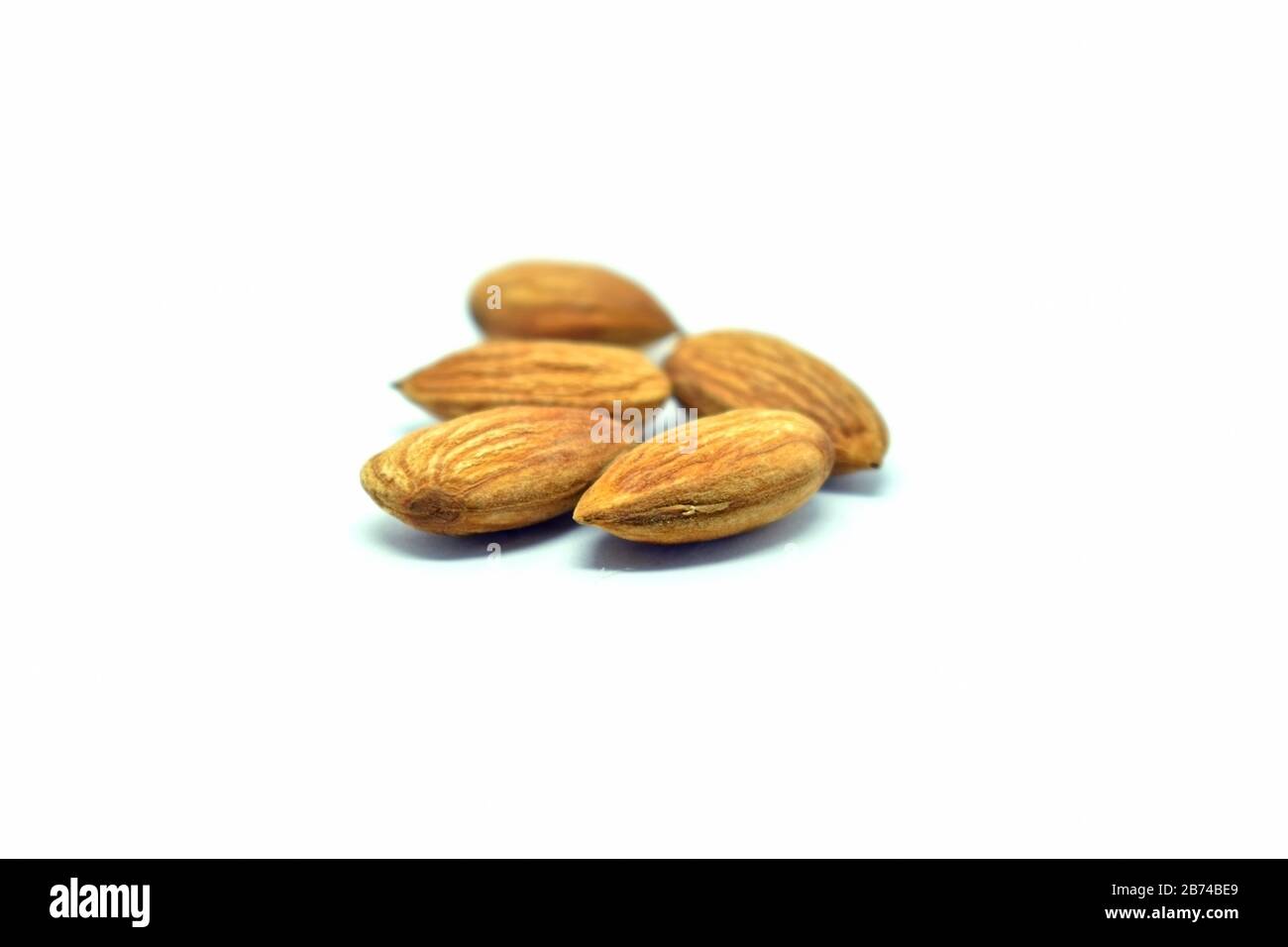 Almond isolated on white background Stock Photo - Alamy