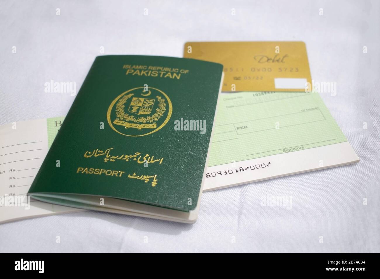 Pakistan international traveling passport over white background Stock Photo