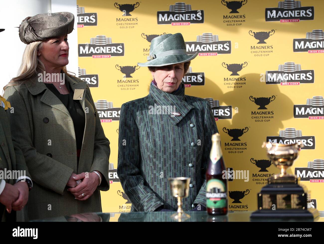 The Princess Royal (right) pbefore presenting a trophy to the winning owners of the Magners Cheltenham Gold Cup Chase during day four of the Cheltenham Festival at Cheltenham Racecourse. Stock Photo