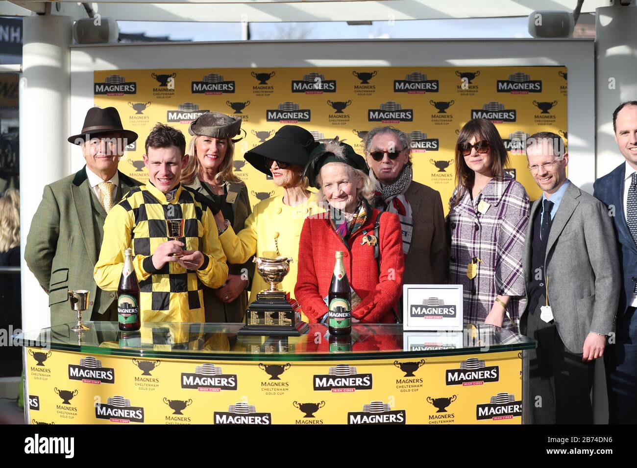Jockey Paul Townend (2nd left) with the owners after winning the Magners Cheltenham Gold Cup Chase with Al Boum Photo during day four of the Cheltenham Festival at Cheltenham Racecourse. Stock Photo