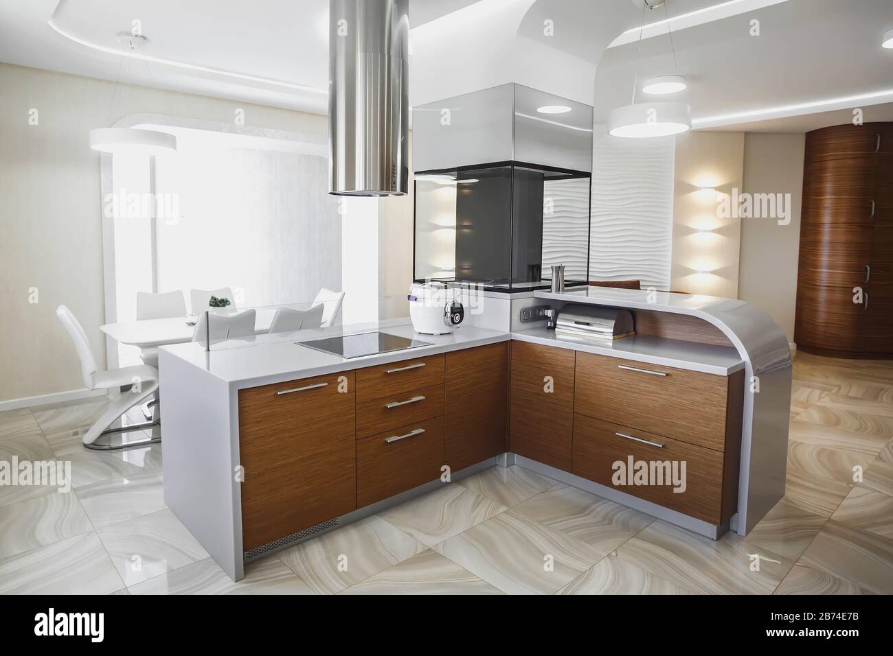 View of luxury expensive modern fitted kitchen with stainless steel
