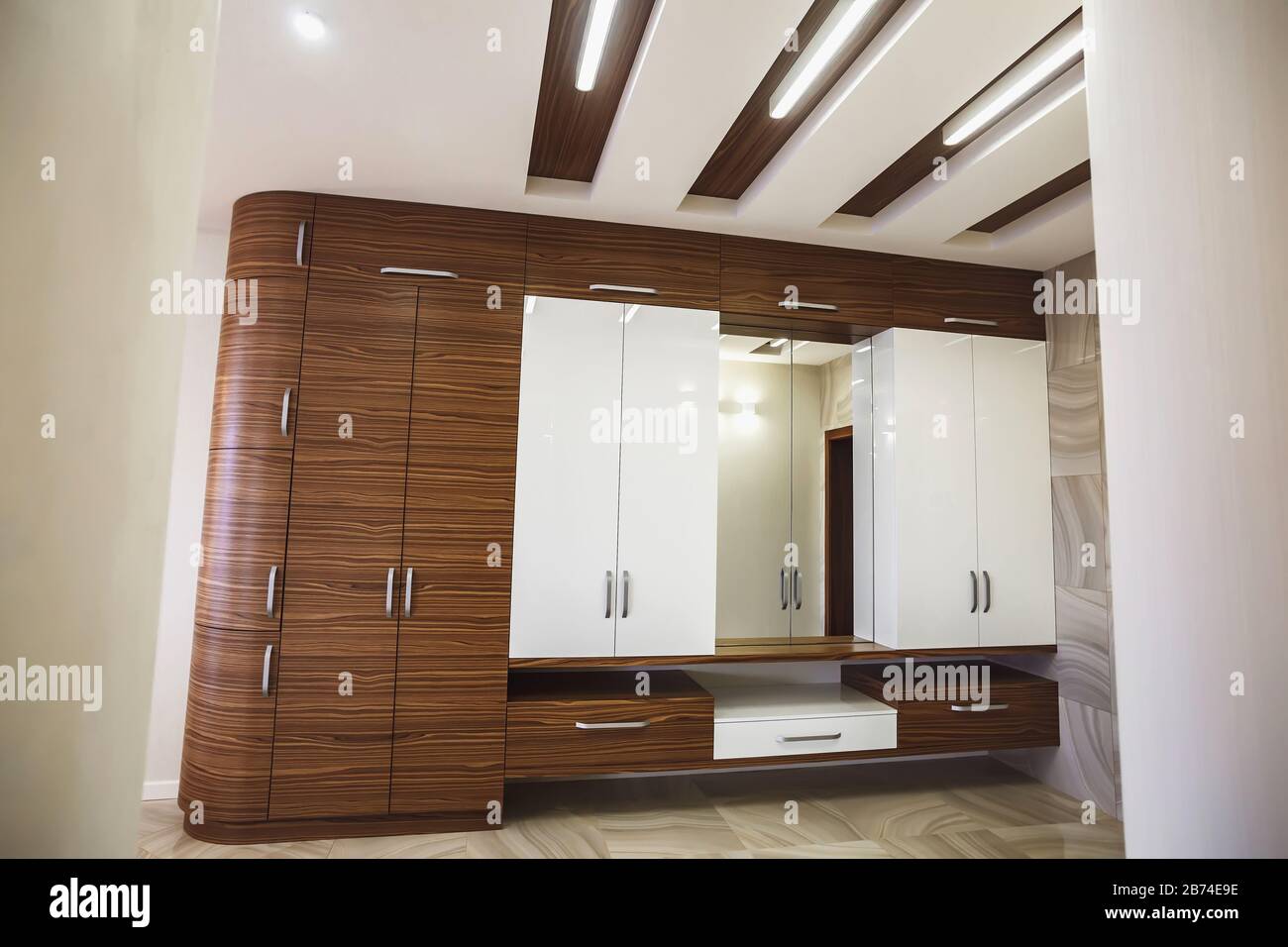 Wooden cabinet in modern hallway interior with luxury marble floor Stock Photo