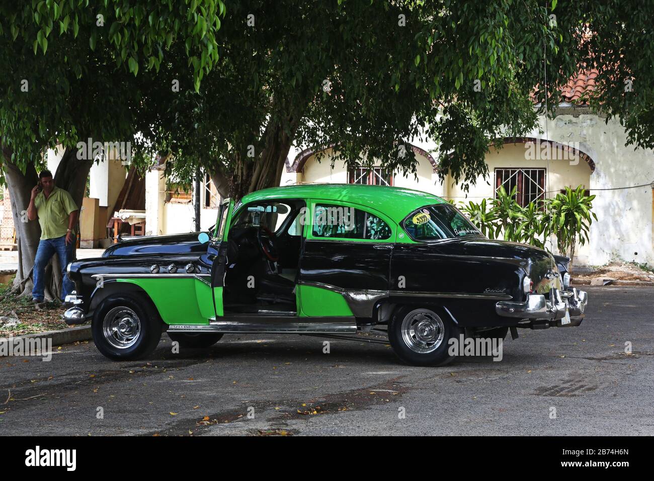 Black and green classic car used as a taxi Stock Photo