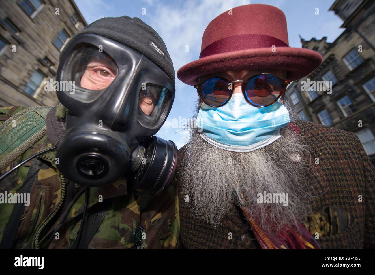 Edinburgh, UK. 13th Mar, 2020. Pictured: (left) Alan Wilson; (right), Jimmy Crombie, wearing personal protective equipment anticipating the ensuing pandemic which is about to hit Scotland. Credit: Colin Fisher/Alamy Live News Stock Photo