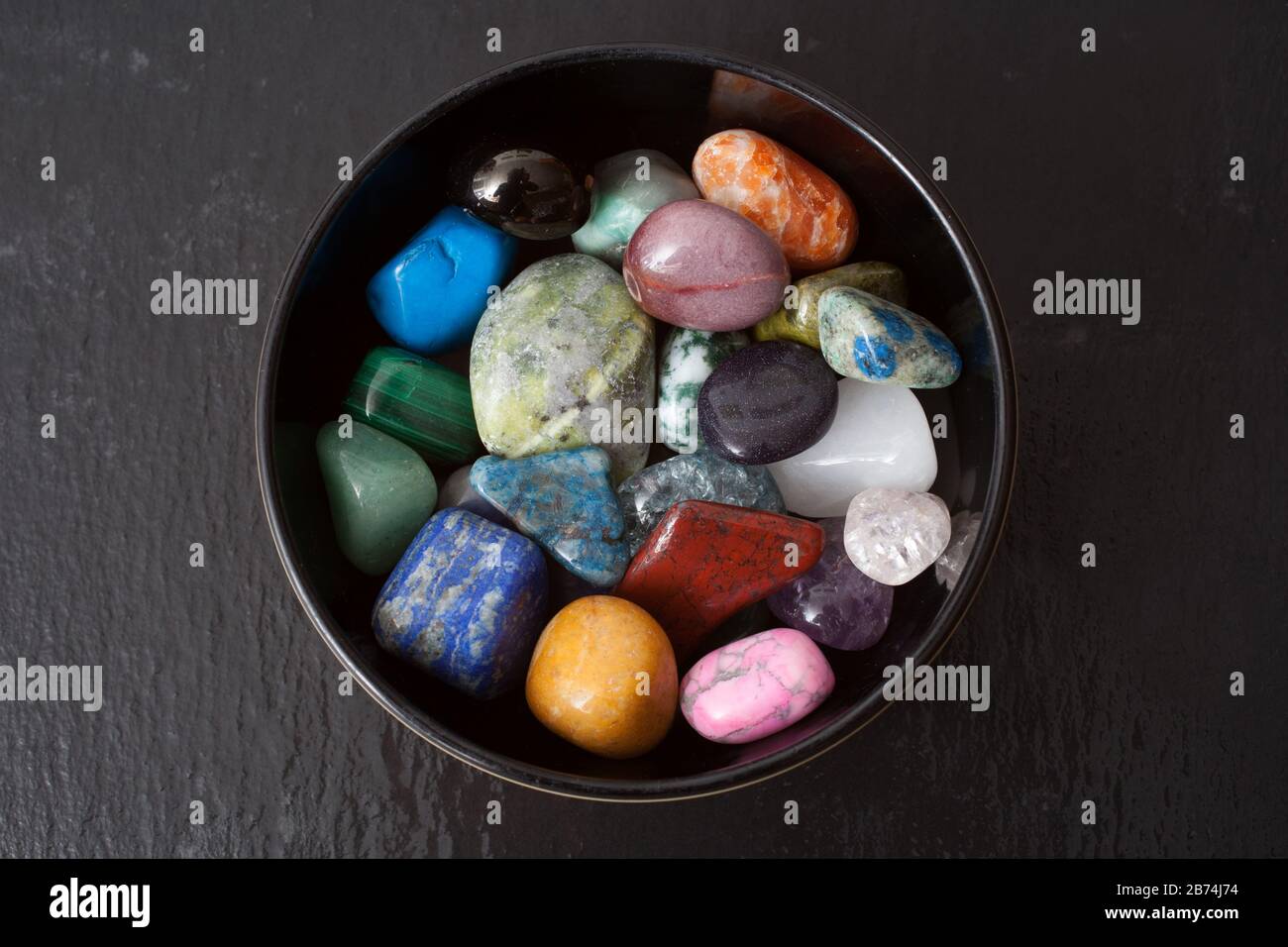 A bowl of different gemstones Stock Photo