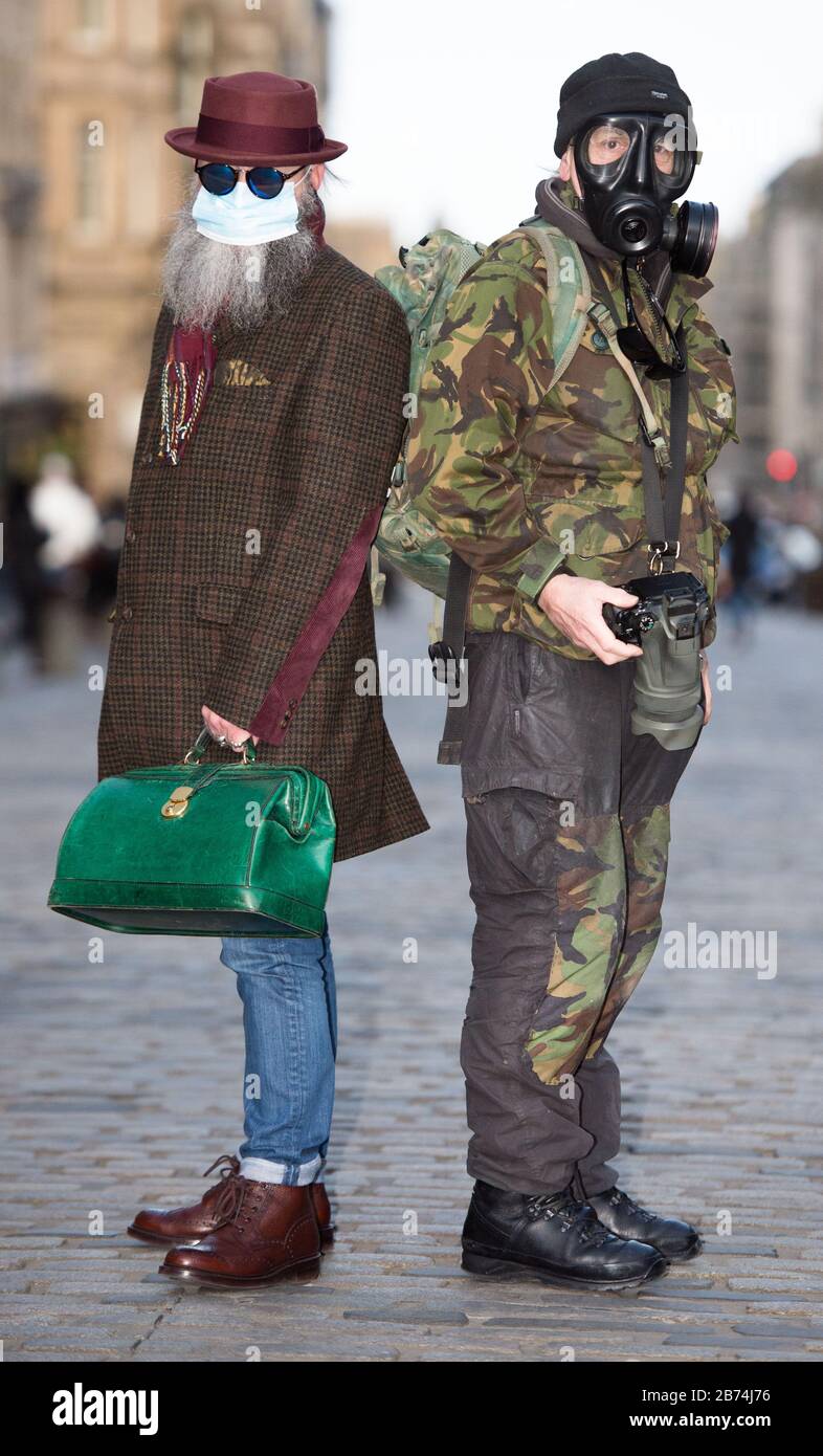 Edinburgh, UK. 13th Mar, 2020. Pictured: (left) Jimmy Crombie; (right), Alan Wilson, wearing personal protective equipment anticipating the ensuing pandemic which is about to hit Scotland. Credit: Colin Fisher/Alamy Live News Stock Photo