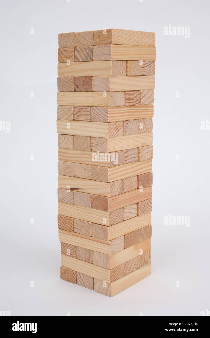 A game with wooden bricks where you have to remove them without knocking it over Stock Photo