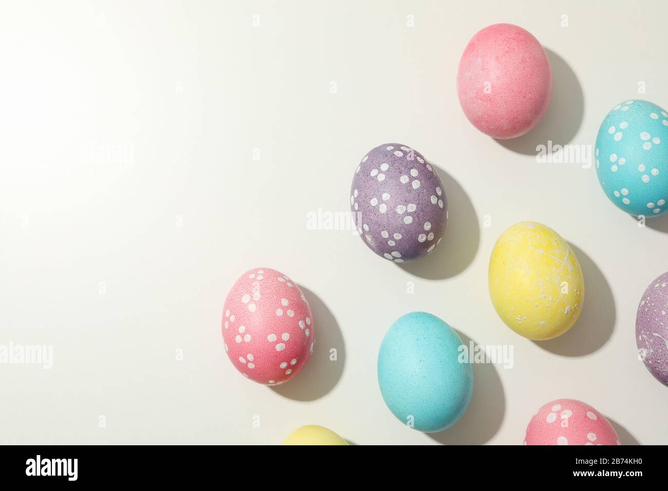 Multicolor Easter eggs on white background, space for text Stock Photo