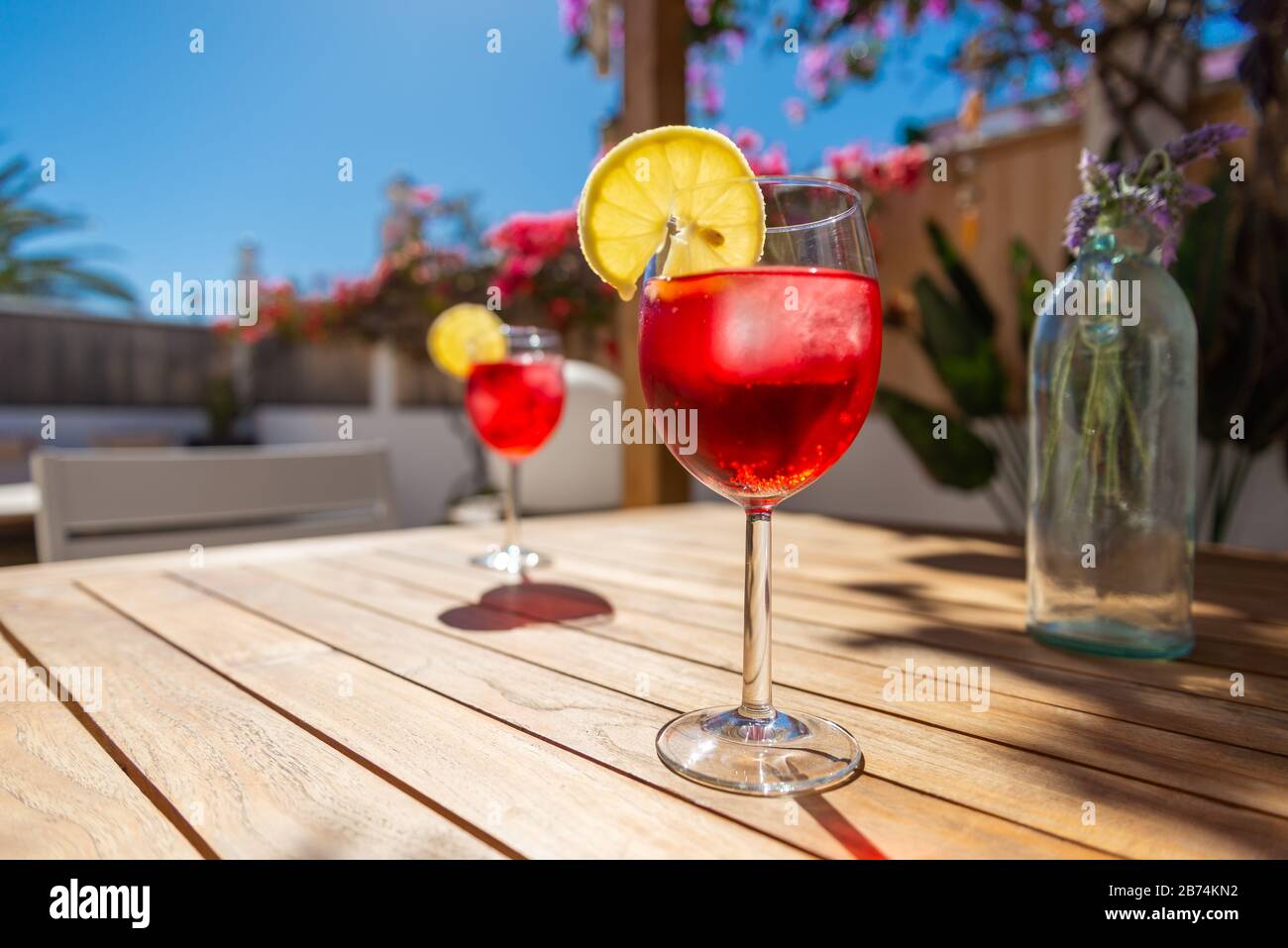 Refreshing Tropical Cocktail Drink on a table in the garden Stock Photo ...