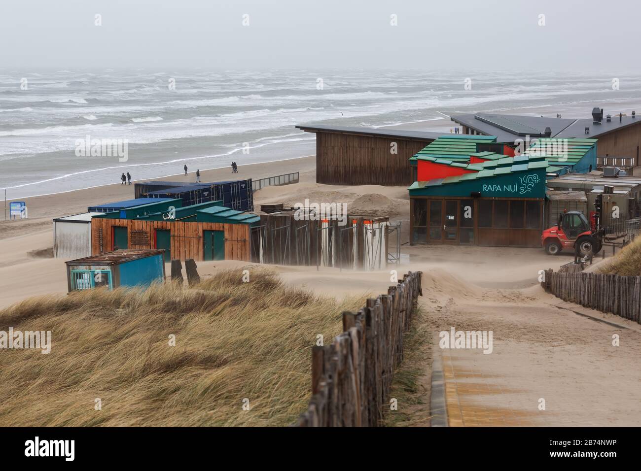 Bloemendaal aan Zee, Netherlands - February 23, 2020: beach restaurant on a stormy day in Bloemendaal with unidentified people. Bloemendaal aan Zee is Stock Photo
