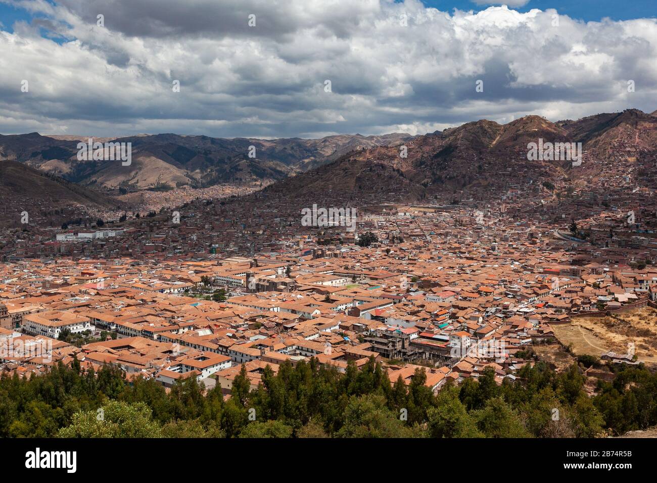 Red brick roofs. Colonial town. Panorama view historical center Cusco Peru Stock Photo