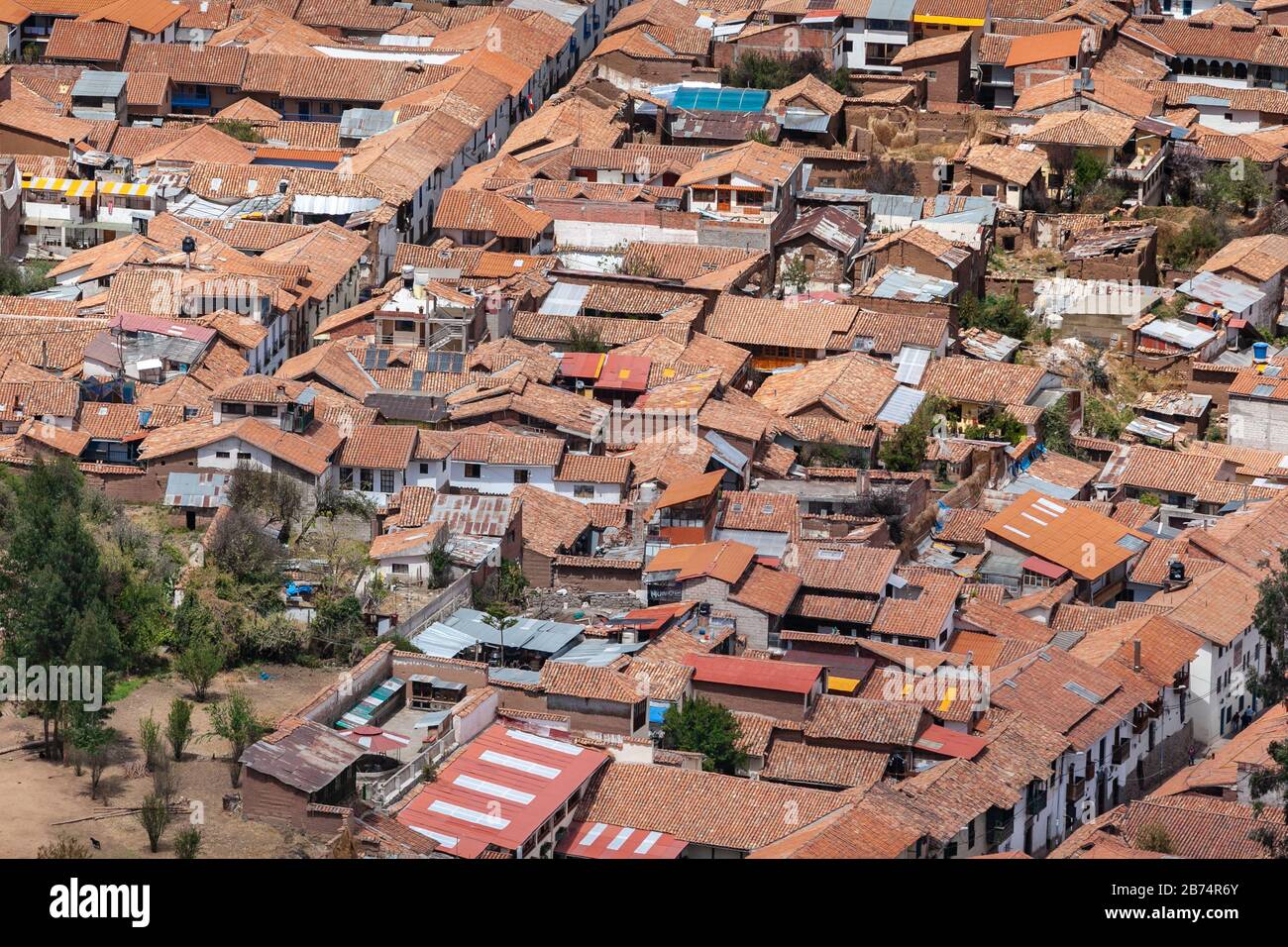 Red brick roofs. Colonial town. Panorama view historical center Cusco Peru Stock Photo