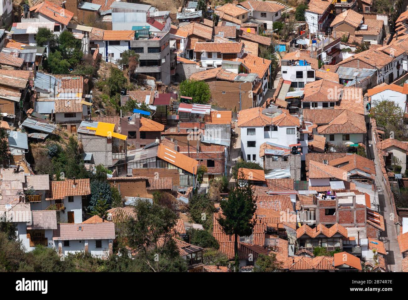 Red brick roofs. Colonial town. Panorama view historical center Cusco Peru Stock Photo