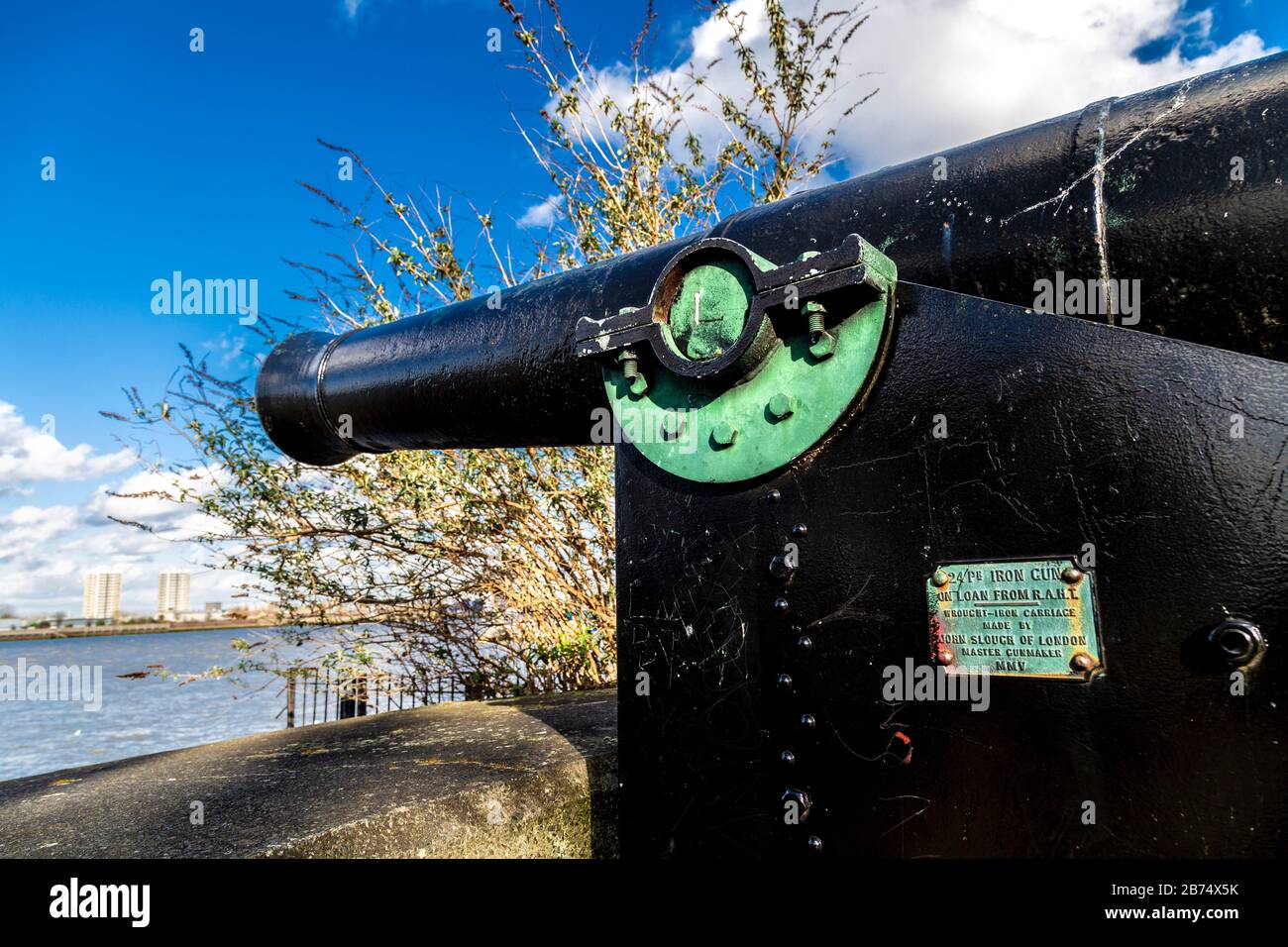 24pr iron cannon made by master gunmaker John Slough of London in a two-cannon battery on the Thames river, used to defend the city, London, UK Stock Photo