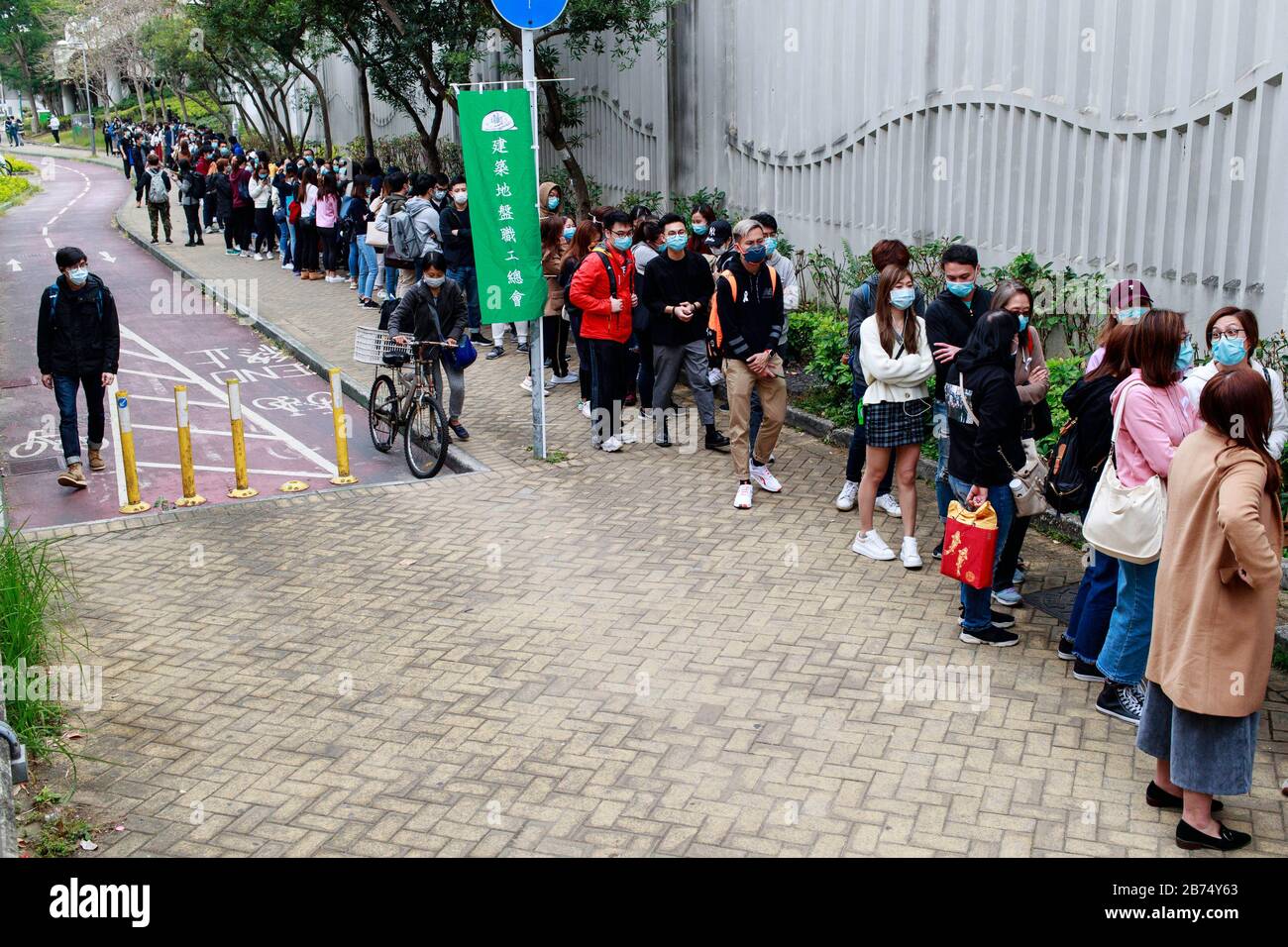 Medical staff line up to registrate for the strike outside Tuen Mun Hospital. About 3000 medical staffs go on strike and threaten to escalate if the government does not close the border. Stock Photo