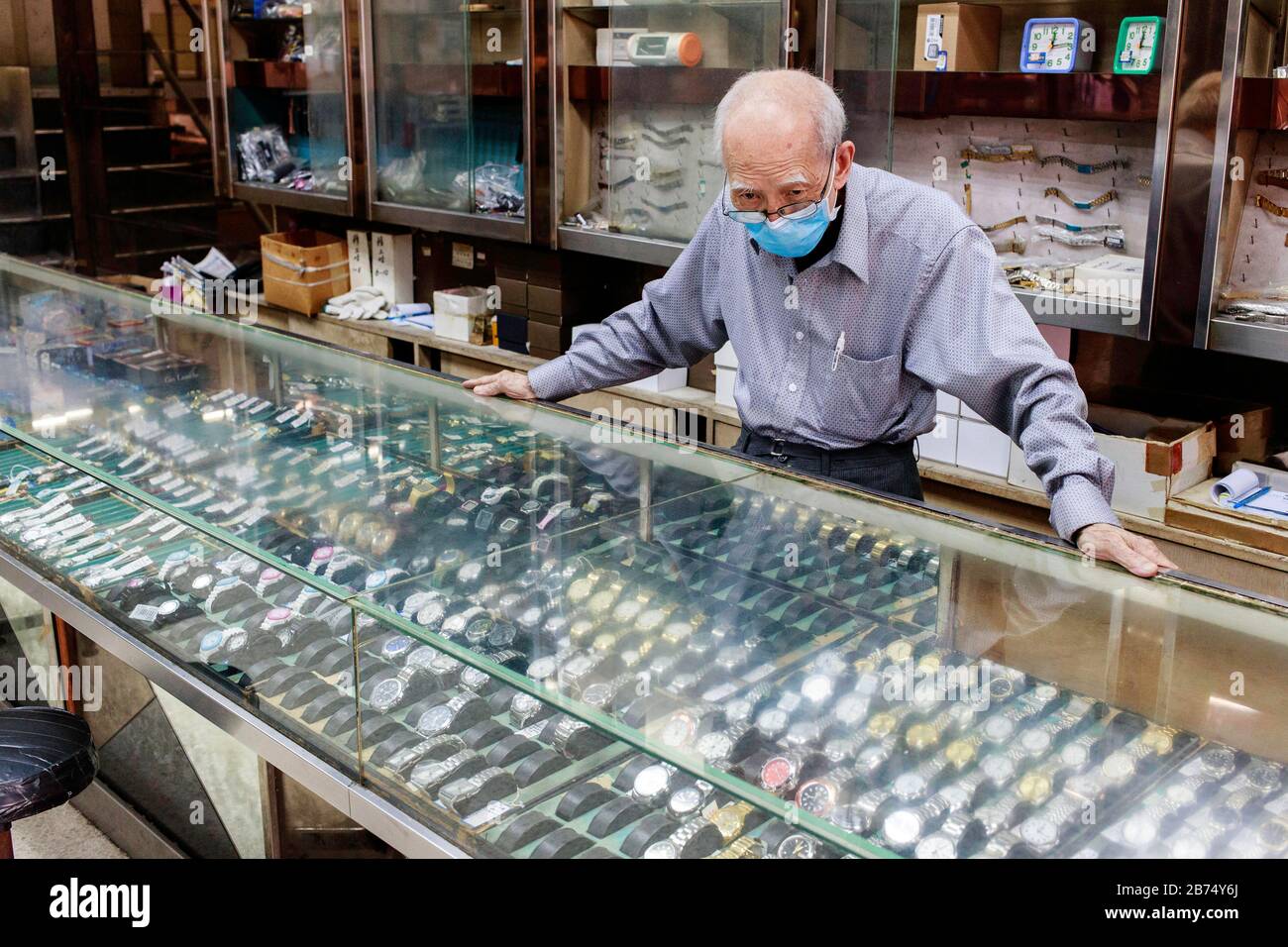 Mr. Luk of 80+ years old, is the owner of a fifty years old watch store which will be closed down permanently. Stock Photo