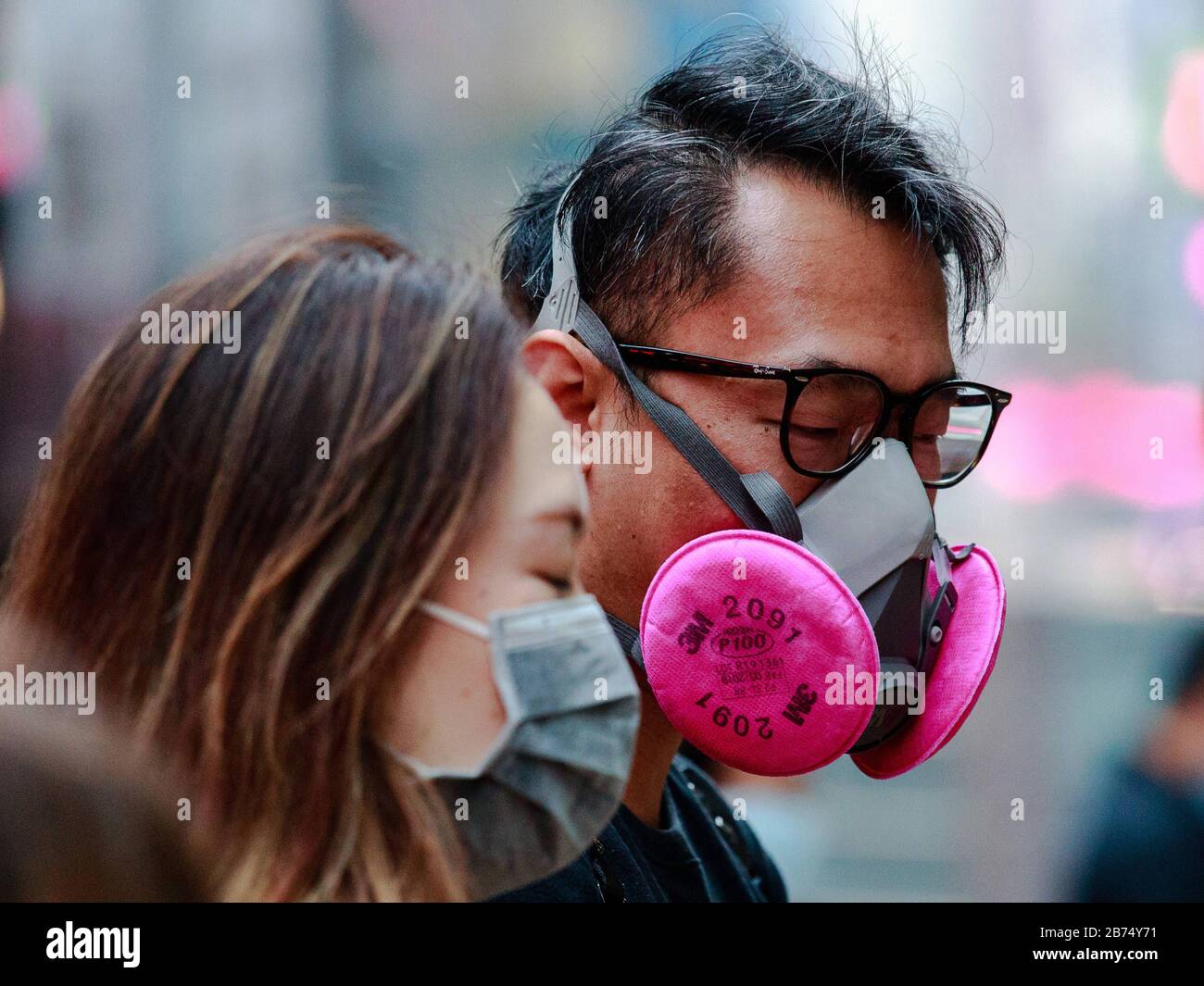 Couples wear mask during St. Valentine's Day in Hong Kong. Stock Photo