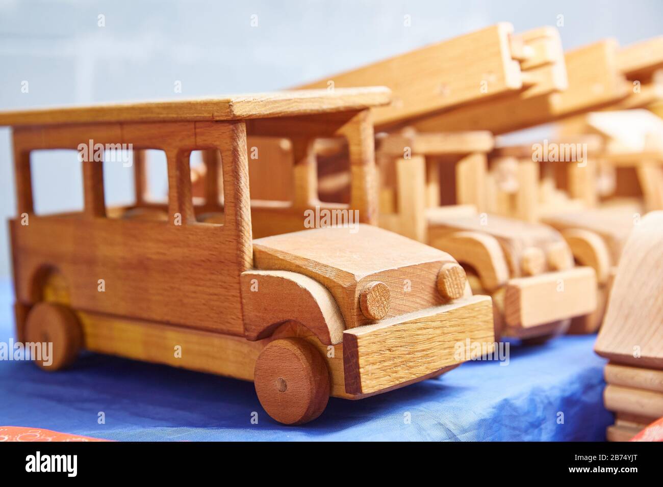 old toy cars made of wood. close-up Stock Photo - Alamy