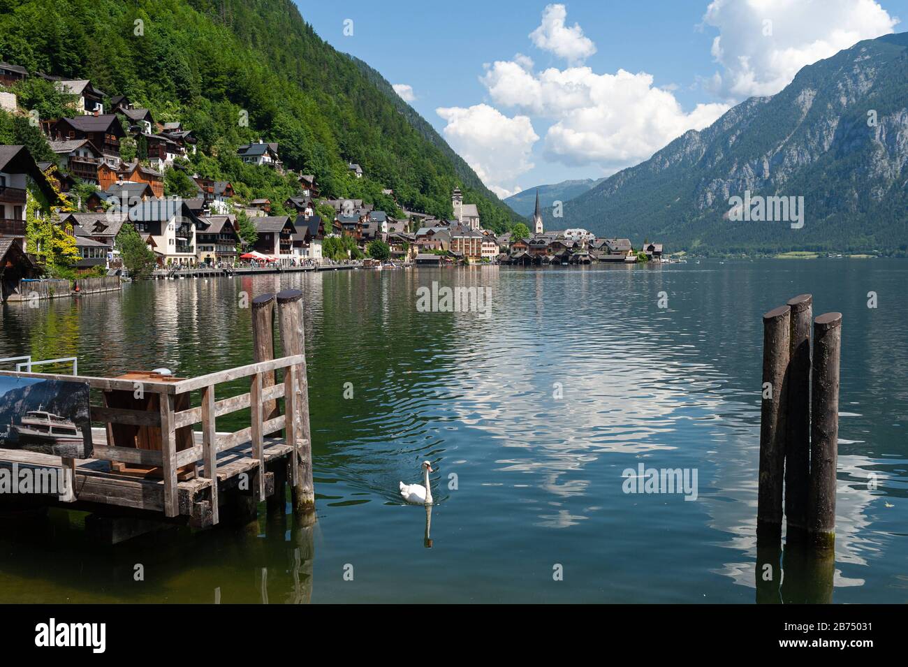 18.06.2019, Hallstatt, Upper Austria, Austria, Europe - View from the shore of the lake Hallstaetter See to the village at the mountainside. The place is a favorite travel destination of Chinese and exists as a replica in the Guangdong province in China. [automated translation] Stock Photo