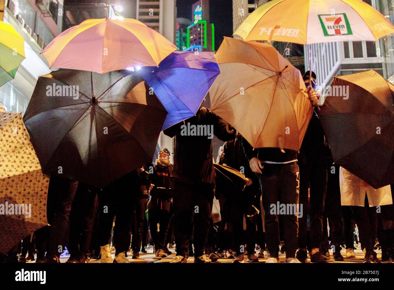 Pro-democracy protesters take part in a march in Hong Kong. Protesters stand off with Police in Central as they try to protect the peaceful march. Stock Photo