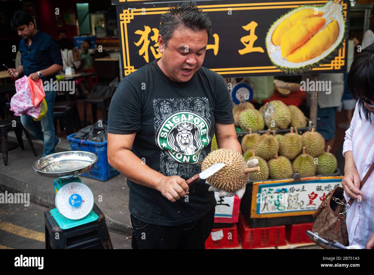 24.02.2019, Singapore, Republic of Singapore, Asia A salesman opens a