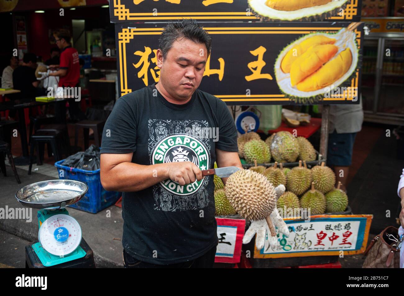 24.02.2019, Singapore, Republic of Singapore, Asia A salesman opens a