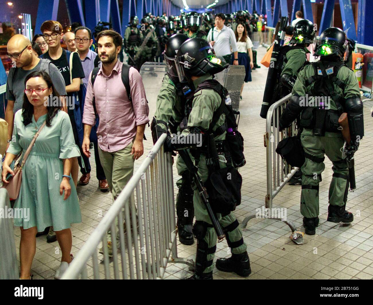 Police stand off with protesters at an officially approved demonstration. Thousands rally pleading with American lawmakers for the second time to pass legislation that supports Hong Kong's democratic movement. Stock Photo