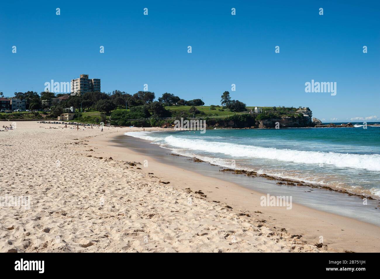 24.09.2019, Sydney, New South Wales, Australia - Sunny sand and sea under a bright blue sky on the beach of Coogee Beach. [automated translation] Stock Photo