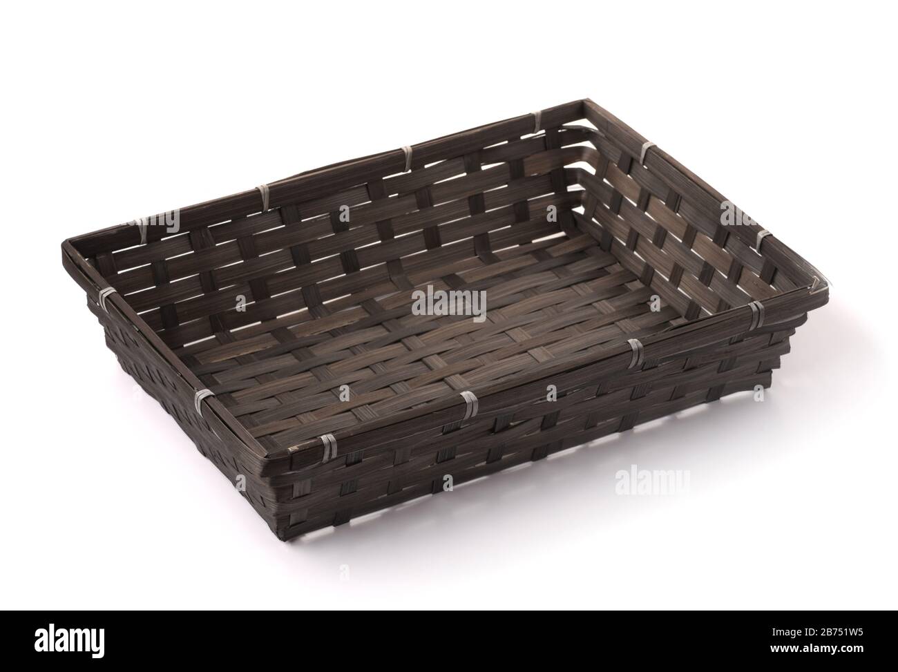 Black empty bamboo wicker tray isolated on white Stock Photo