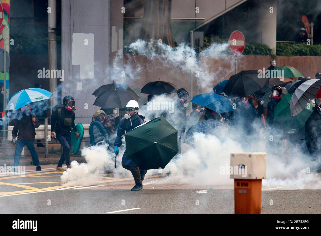 Protesters clash with Anti-riot police during an unauthorised global anti-totalitarian march in Hong Kong, China. Stock Photo