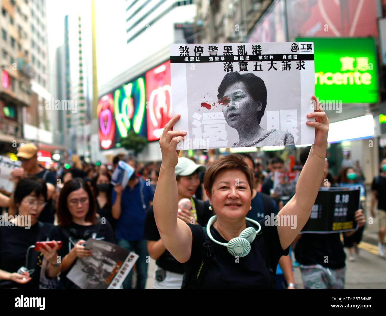 Hundreds of thousands of protesters dressed in black from all ages rallied in Victoria Park. Many marched 3 kilometers under the rain to the city's financial district,  in defiance of a police ban on any procession outside the park. The march was peaceful in constrast to the recent bloody clashes between police and protesters. Stock Photo