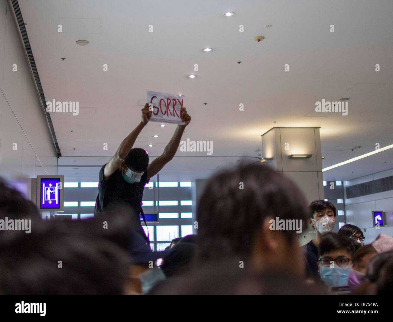 Anti-government protesters occupy Hong Kong International Airport in Hong Kong. A policeman allegly shot at a nurse's right eye that would caused permanent bllindness during a protest on 11 Aug 2019. All flights were cancelled in the late afternoon. Stock Photo