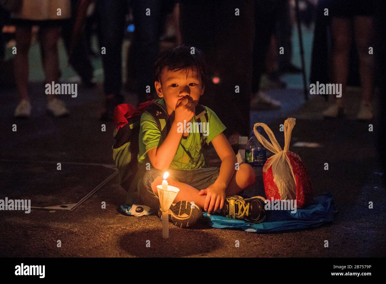 Participants attend the annual candlelit vigil commemorating the 30th anniversary of the 1989 Beijing Tiananmen Square massacre at Victoria Park In Hong Kong, China, 4 June 2019. Stock Photo