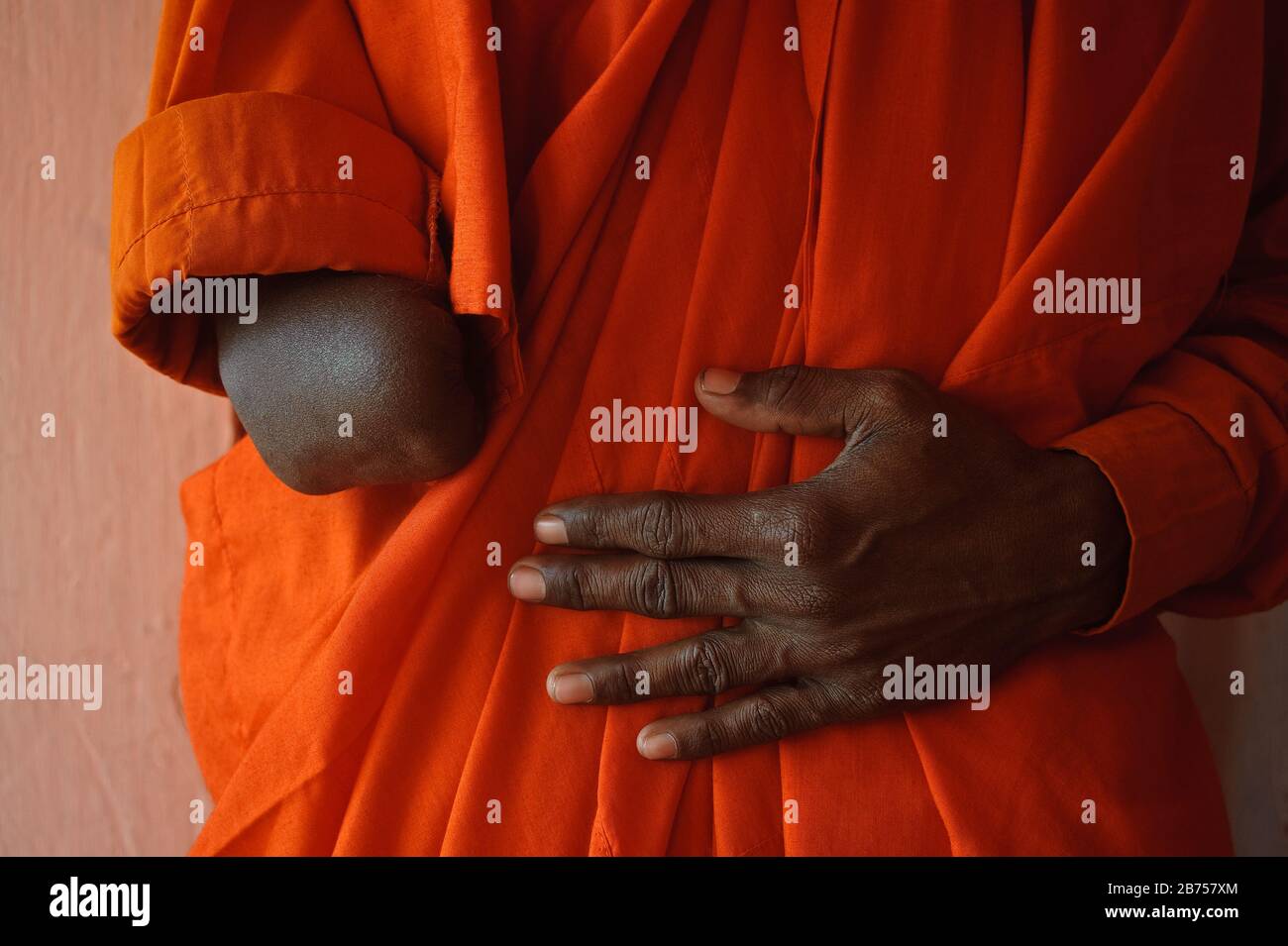 Amputee buddhist monk ( India) Stock Photo