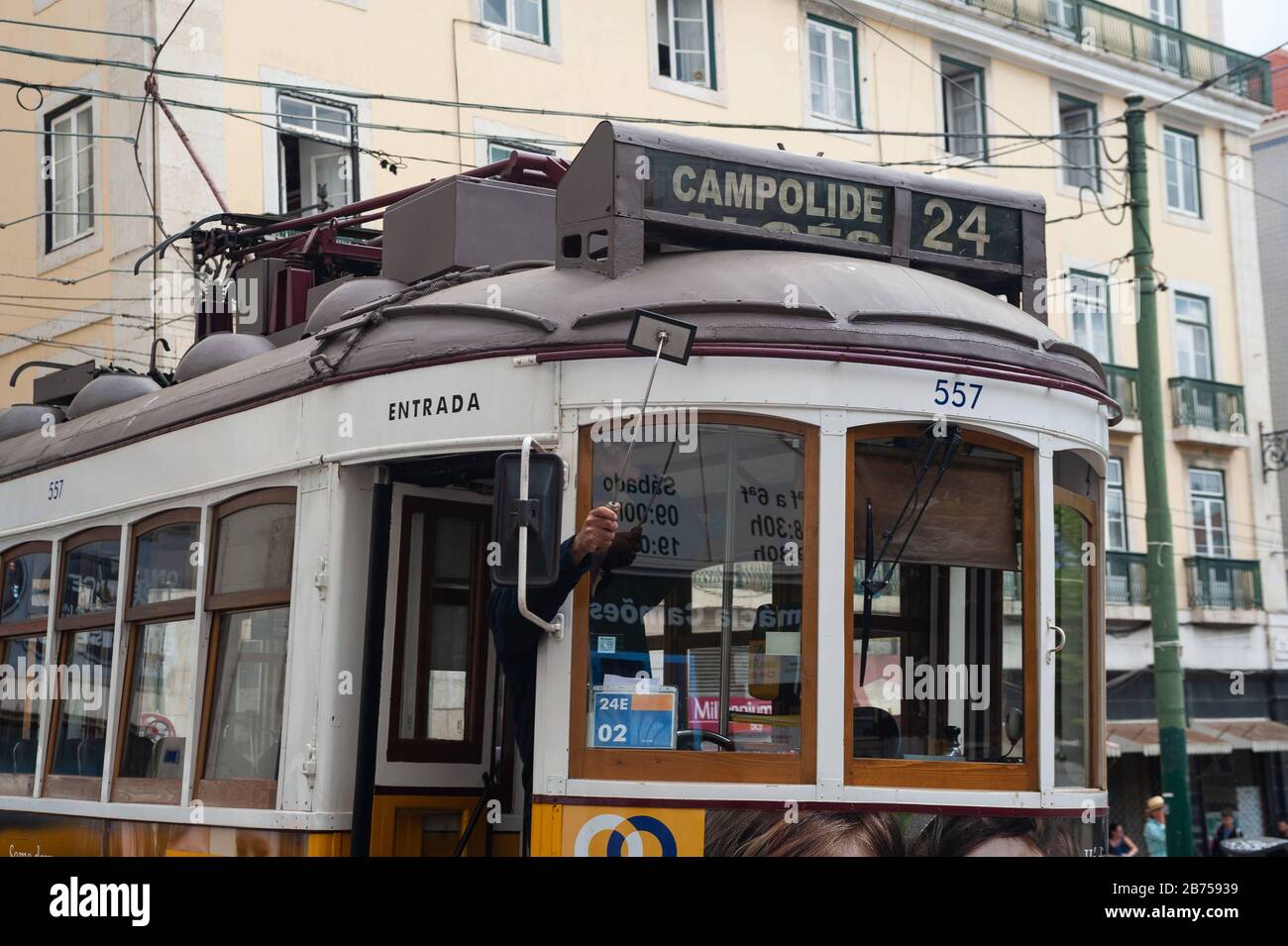 10.06.2018, Lisbon, Portugal, Europe - A tram driver uses a small mirror to adjust the destination display of his tram. [automated translation] Stock Photo